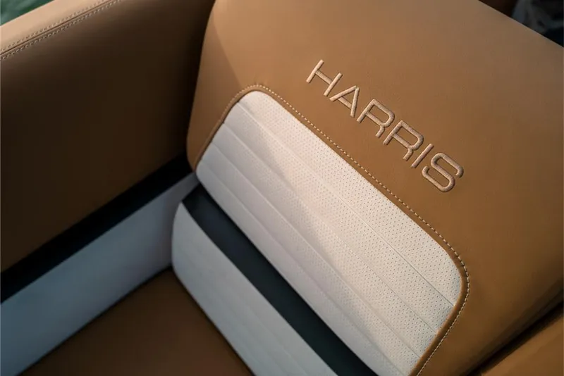 Slide: The Image of 2023 Harris Solstice 250 boat seat with tan and white upholstery. - 18