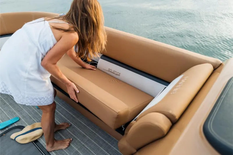 Slide: The Image of Woman adjusting seat on 2023 Harris Solstice 250 boat. - 27