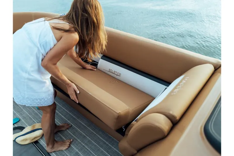 Slide: The Image of Woman adjusting seat on 2023 Harris Solstice 250 boat. - 28