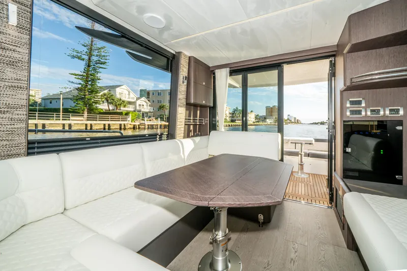 Slide: The Image of Luxurious interior of 2023 Galeon 400 Fly yacht with modern seating and scenic views. - 19