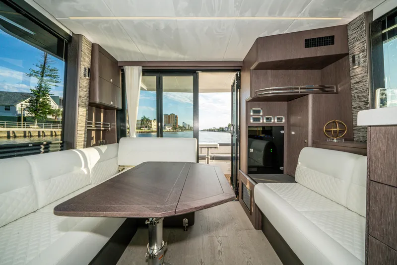 Slide: The Image of Luxurious interior of 2023 Galeon 400 Fly yacht with modern seating and scenic views. - 20