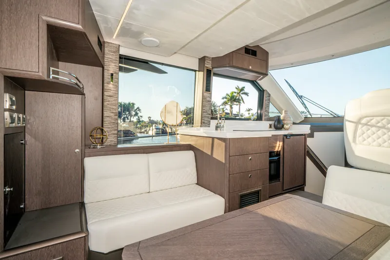 Slide: The Image of Luxurious interior of 2023 Galeon 400 Fly yacht with modern furnishings and panoramic windows. - 21