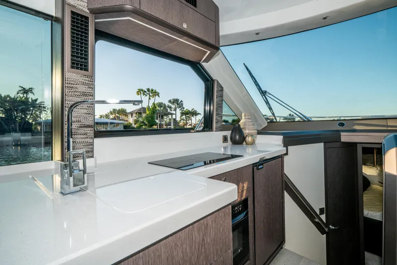Slide: The Image of Modern kitchen interior of 2023 Galeon 400 Fly yacht with sleek design and waterfront view. - 22