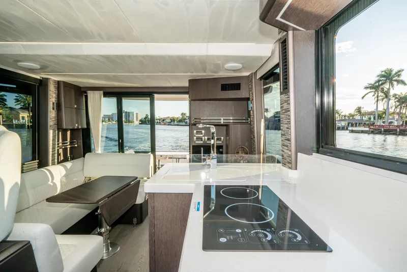 Slide: The Image of Luxurious interior of 2023 Galeon 400 Fly yacht with modern kitchen and waterfront view. - 26