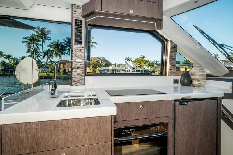 Slide: The Image of Luxurious kitchen interior of 2023 Galeon 400 Fly yacht with scenic water view. - 29