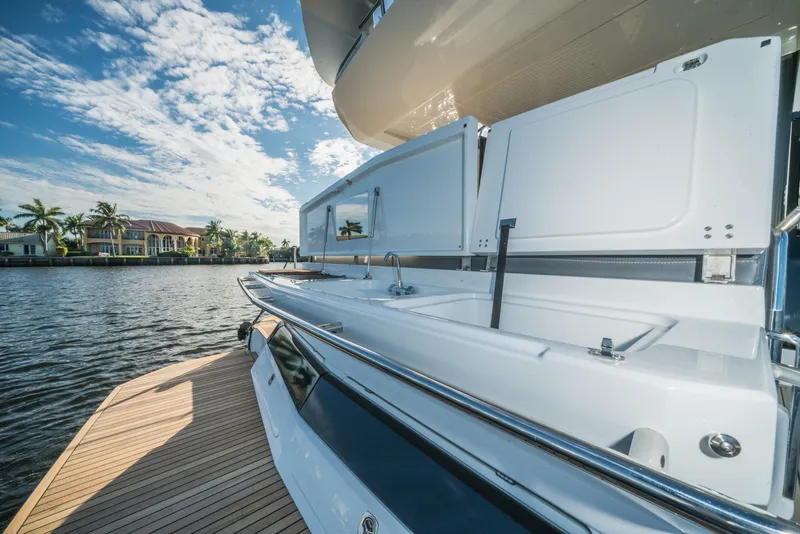 Slide: The Image of 2023 Galeon 400 Fly yacht with open deck kitchen by the water. - 31