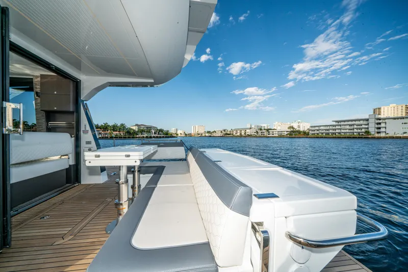 Slide: The Image of 2023 Galeon 400 Fly yacht deck with waterfront view and clear blue sky. - 45