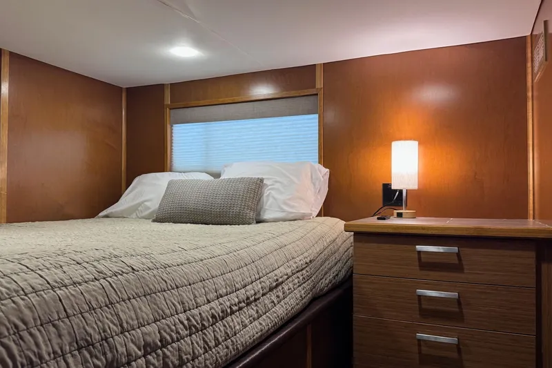 Slide: The Image of Cozy bedroom in 2015 Bravada Intrepid Share #10 with wooden walls and soft lighting. - 16