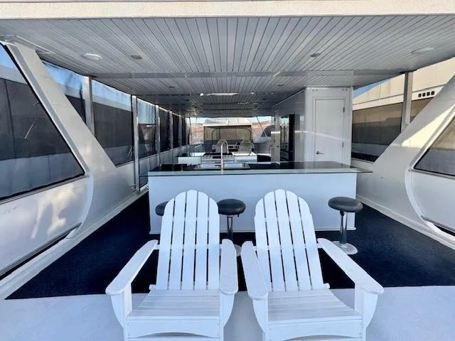 Slide: The Image of Luxurious Bravada Intrepid Share #10 yacht interior with seating and bar area, 2015 model. - 24