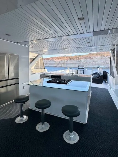 Slide: The Image of Luxurious 2015 Bravada Intrepid Share #10 yacht interior with modern kitchen and seating area. - 27