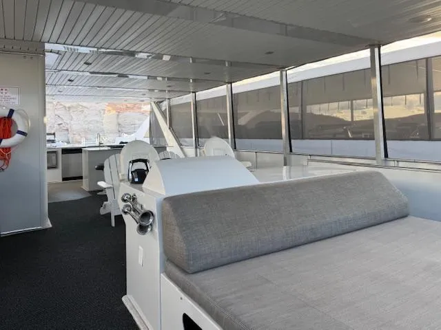 Slide: The Image of Spacious interior of 2015 Bravada Intrepid Share #10 houseboat with modern seating and kitchen area. - 28