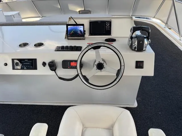 Slide: The Image of Helm of 2015 Bravada Intrepid Share #10 with steering wheel and navigation equipment. - 29