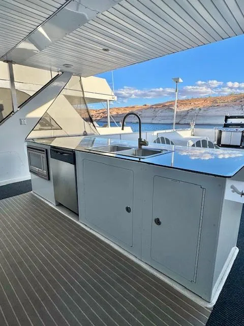 Slide: The Image of Outdoor kitchen on 2015 Bravada Intrepid Share #10 houseboat with scenic water view. - 33