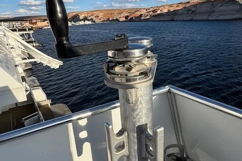Slide: The Image of Boat deck with winch handle, Bravada Intrepid Share #10, 2015, overlooking scenic water and cliffs. - 34