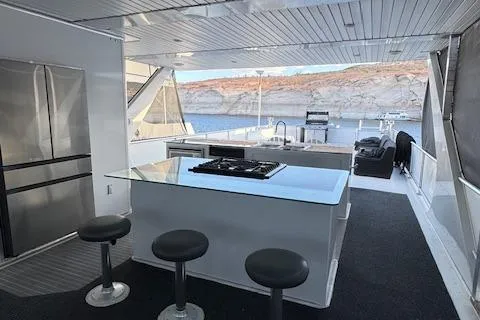 Slide: The Image of Modern kitchen and seating area on 2015 Bravada Intrepid Share #10 houseboat. - 37