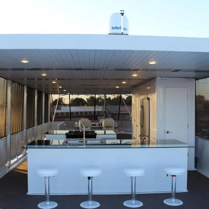 Slide: The Image of Modern Bravada Intrepid Share #10 houseboat interior with sleek kitchen and bar stools, 2015 model. - 9