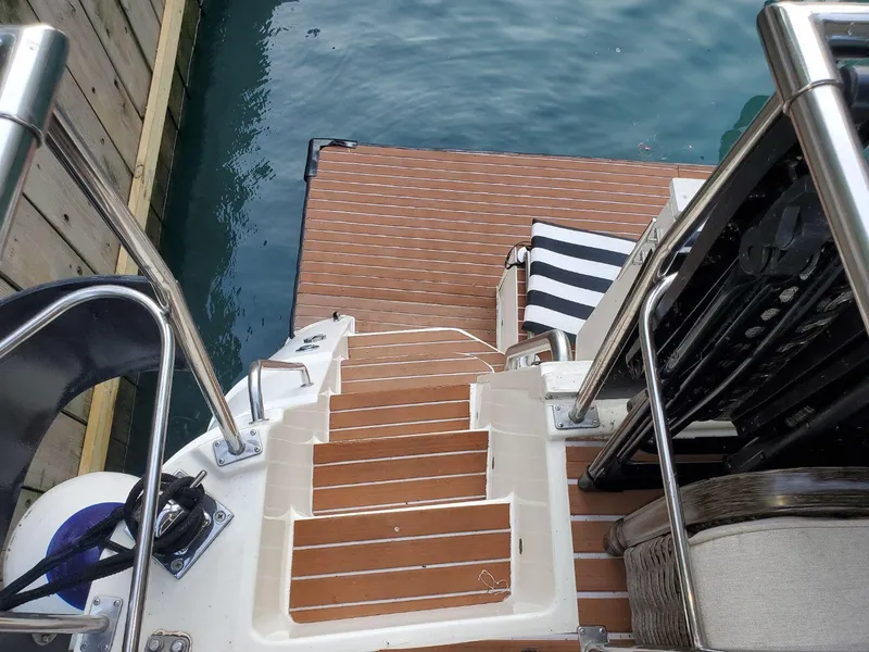 Slide: The Image of Stairs to swim platform on 1991 Cruisers Yachts 3850 Aft Cabin. - 12