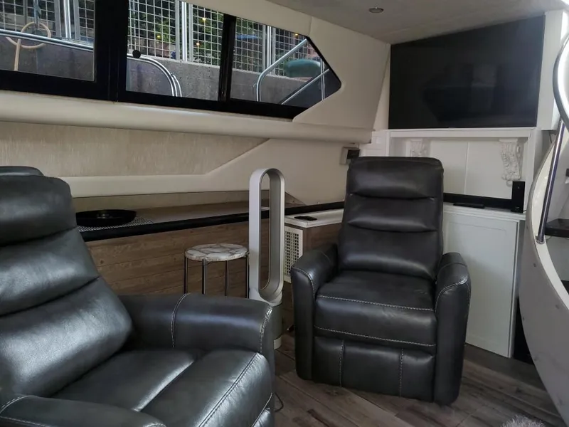 Slide: The Image of Interior of 1991 Cruisers Yachts 3850 Aft Cabin with leather chairs. - 19