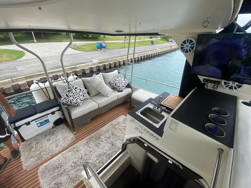 Slide: The Image of 1991 Cruisers Yachts 3850 Aft Cabin with stylish interior and waterfront view. - 23