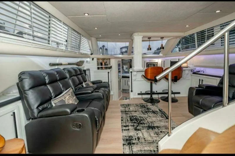 Slide: The Image of Luxurious interior of 1991 Cruisers Yachts 3850 Aft Cabin with leather seating and modern decor. - 28