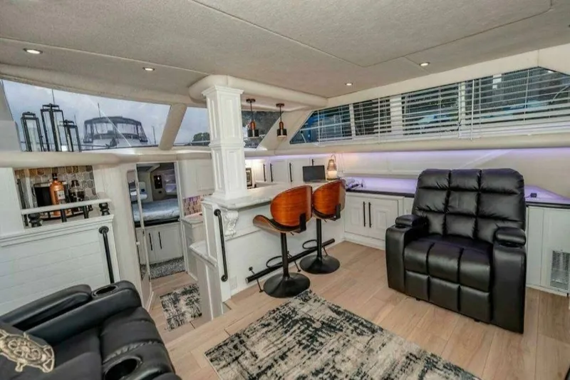 Slide: The Image of Luxurious 1991 Cruisers Yachts 3850 Aft Cabin interior with modern seating and stylish decor. - 29