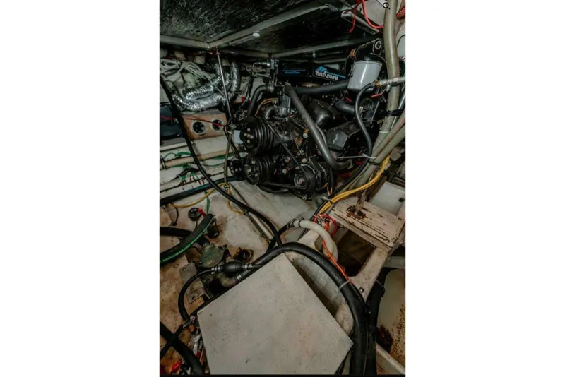 Slide: The Image of Engine room of 1991 Cruisers Yachts 3850 Aft Cabin with visible mechanical components. - 32