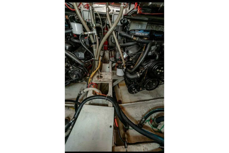 Slide: The Image of Engine room of 1991 Cruisers Yachts 3850 Aft Cabin, showcasing mechanical components. - 34
