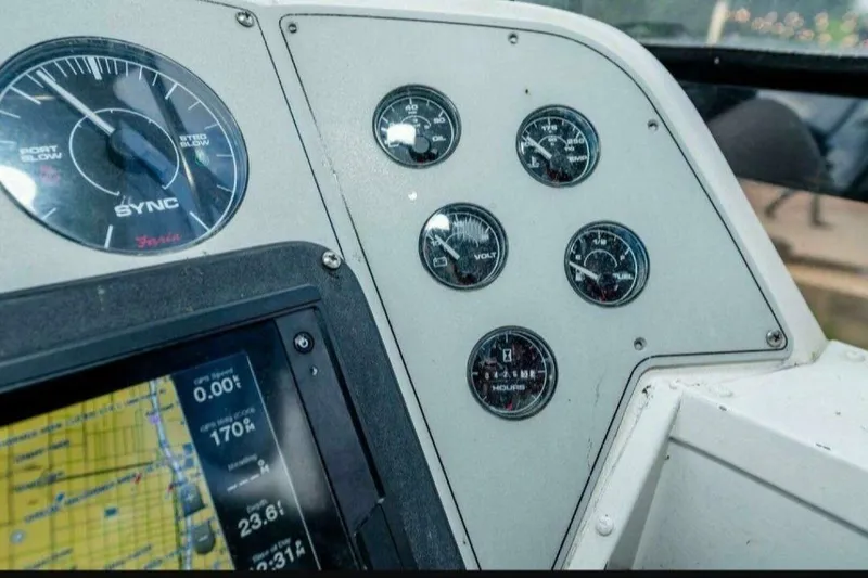 Slide: The Image of Instrument panel of 1991 Cruisers Yachts 3850 Aft Cabin with gauges and navigation display. - 38