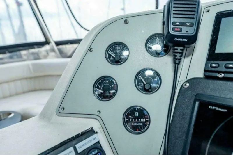 Slide: The Image of Instrument panel of 1991 Cruisers Yachts 3850 Aft Cabin with gauges and Garmin device. - 39