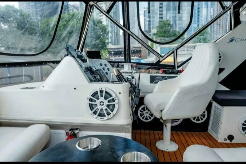 Slide: The Image of Interior of 1991 Cruisers Yachts 3850 Aft Cabin with helm and white seating. - 43
