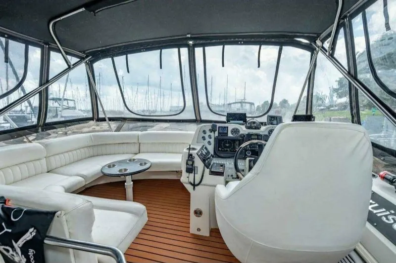 Slide: The Image of Interior of 1991 Cruisers Yachts 3850 Aft Cabin with helm and seating area. - 44