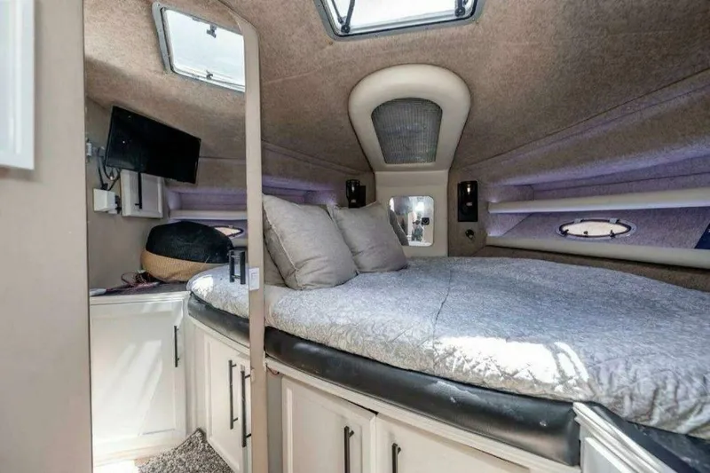 Slide: The Image of 1991 Cruisers Yachts 3850 Aft Cabin interior with cozy bed and modern amenities. - 45