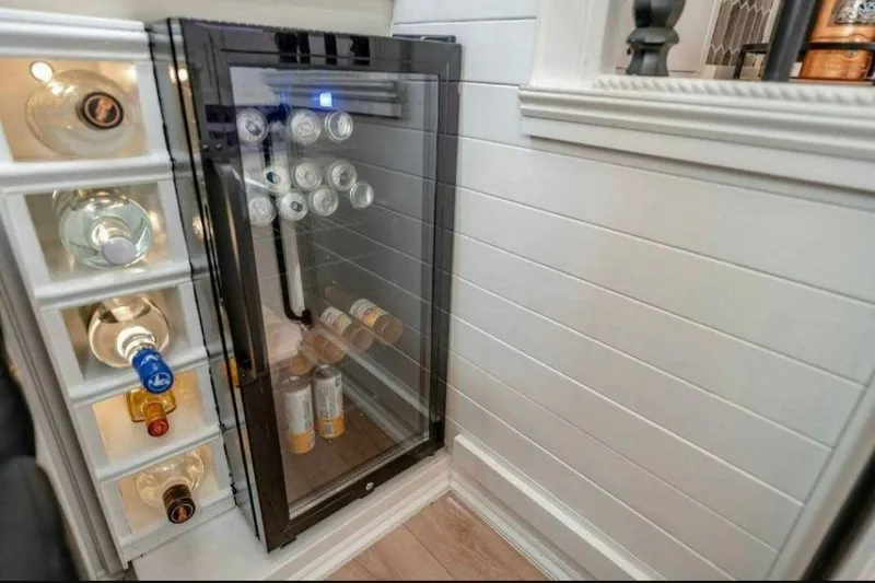Slide: The Image of Mini fridge and wine storage in 1991 Cruisers Yachts 3850 Aft Cabin. - 58