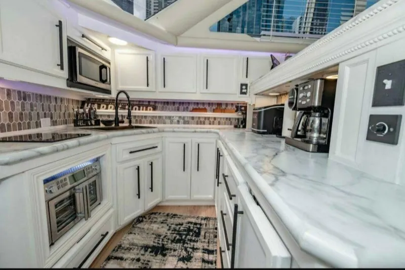 Slide: The Image of Modern kitchen in 1991 Cruisers Yachts 3850 Aft Cabin with marble countertops and appliances. - 59