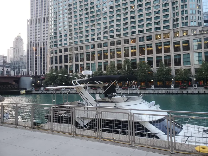 Slide: The Image of 1991 Cruisers Yachts 3850 Aft Cabin by urban skyline. - 8