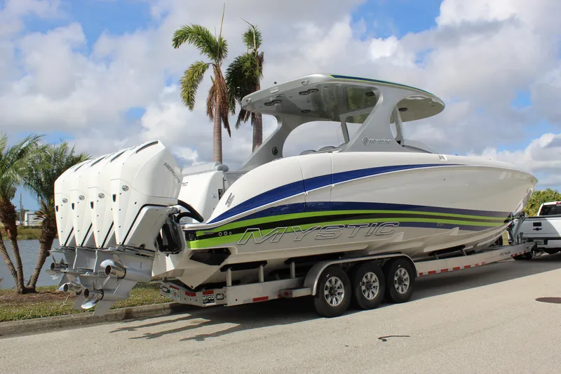 Slide: The Image of 2020 Mystic Powerboats M4200 on trailer, featuring sleek design and powerful engines. - 20