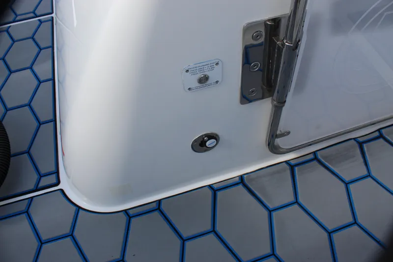 Slide: The Image of Mystic Powerboats M4200 2020 model, deck detail with hexagonal pattern and hardware. - 26