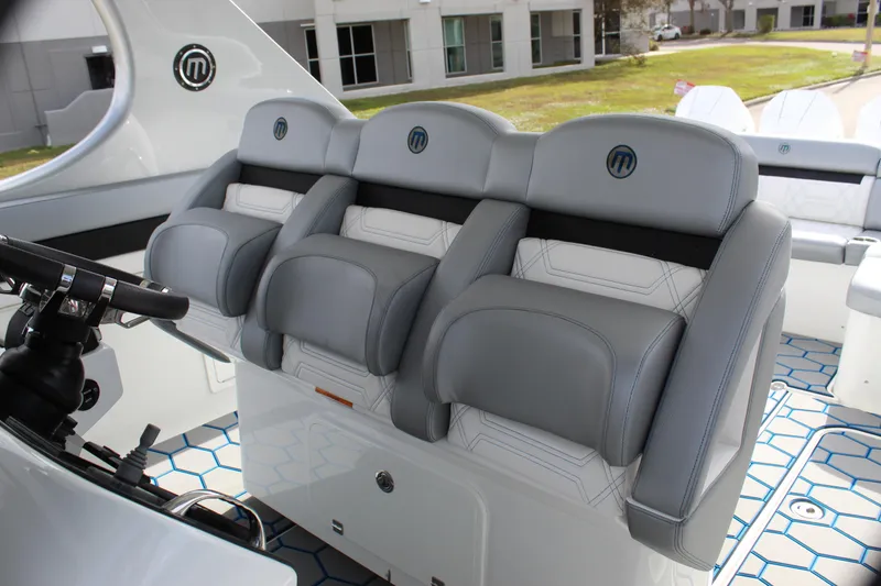 Slide: The Image of 2020 Mystic Powerboats M4200 interior with luxurious gray seating and modern design. - 39