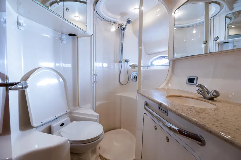 Slide: The Image of Luxurious 2003 Sea Ray Express Bridge bathroom with shower, toilet, and vanity. - 10