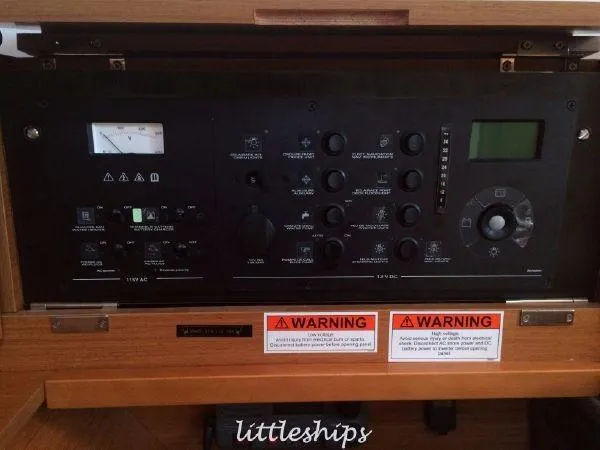 Slide: The Image of Control panel of 2015 Jeanneau Sun Odyssey 469 sailboat with warning labels. - 21