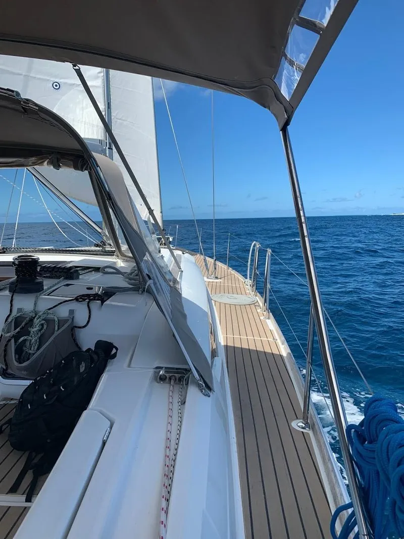 Slide: The Image of 2015 Jeanneau Sun Odyssey 469 sailing on open sea under clear blue skies. - 30