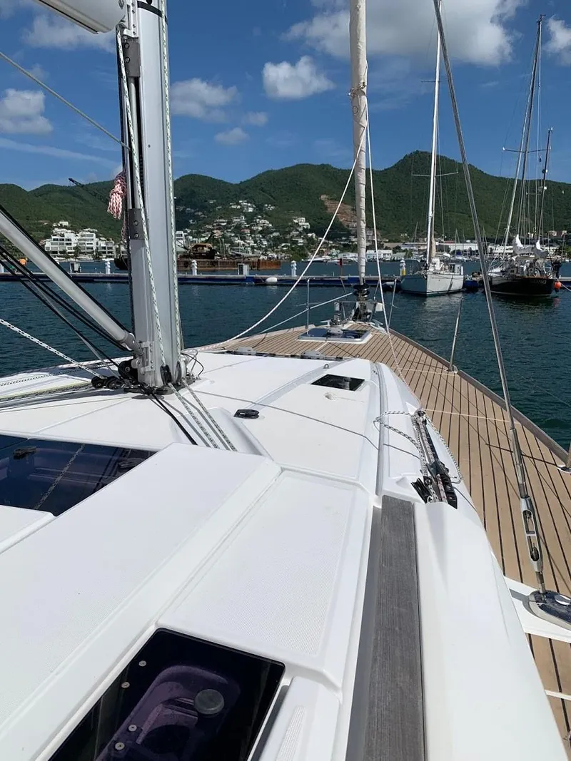 Slide: The Image of Jeanneau Sun Odyssey 469 sailboat docked in a scenic marina, 2015 model. - 37