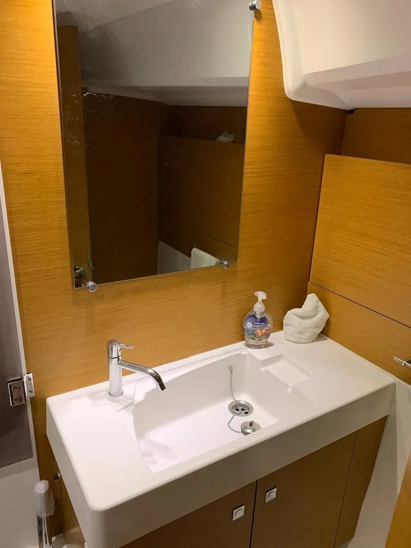 Slide: The Image of 2015 Jeanneau Sun Odyssey 469 bathroom with modern sink and mirror. - 46