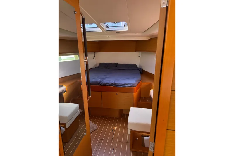 Slide: The Image of Cozy cabin interior of 2015 Jeanneau Sun Odyssey 469 sailboat with wooden finishes. - 49