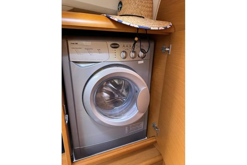 Slide: The Image of Washing machine inside Jeanneau Sun Odyssey 469 yacht, 2015 model, with a straw hat on top. - 57