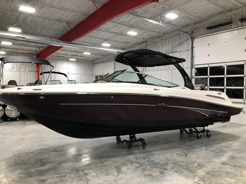 The Image of 2012 Sea Ray 250 SLX boat in indoor storage facility. - 1