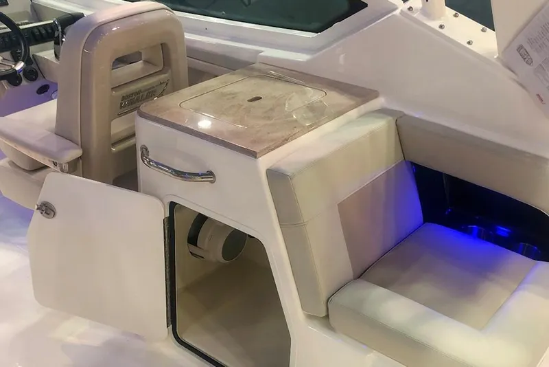 Slide: The Image of 2023 Boston Whaler 280 Vantage interior seating and storage area. - 8