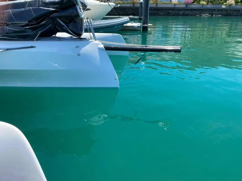 Slide: The Image of Corsair 880 boat docked in clear turquoise water, 2025 model. - 11