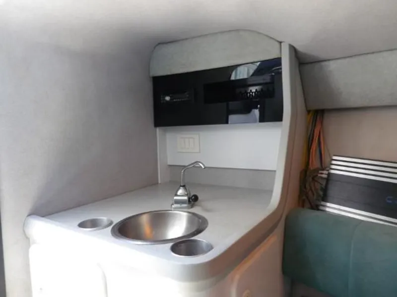 Slide: The Image of 1992 Formula Boats 27 interior kitchenette with sink and storage. - 14