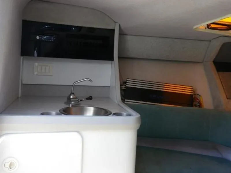 Slide: The Image of Interior of 1992 Formula Boats 27 model, featuring a compact sink and countertop. - 17
